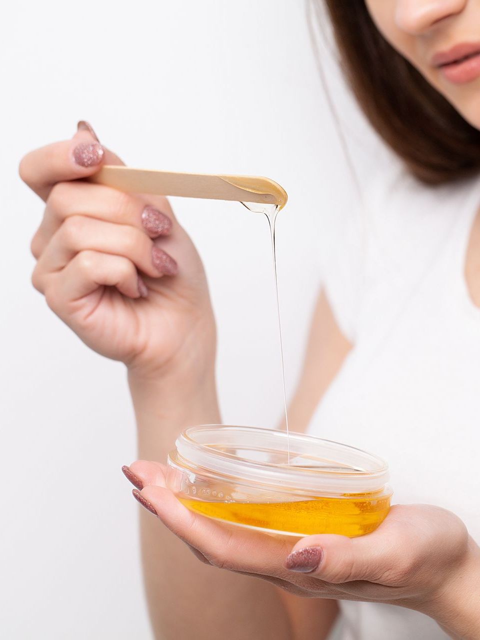 woman holding wax