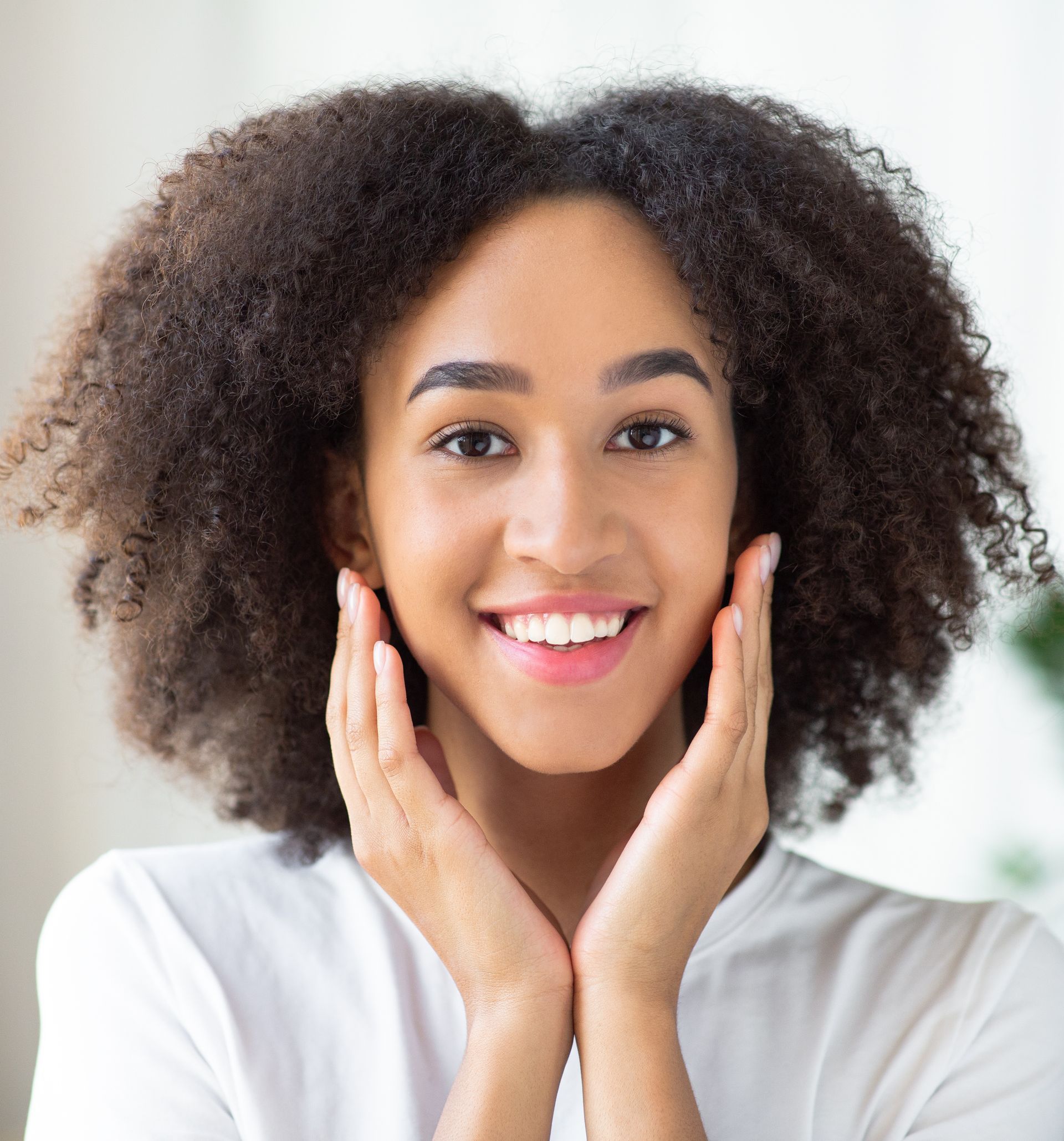 smiling woman in white tshirt