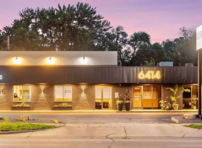 A brick building with a sign that says mn naf