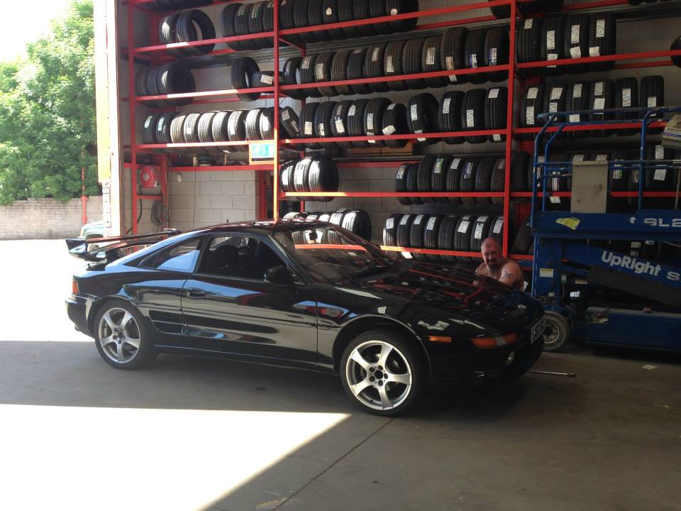 image of black car in workshop