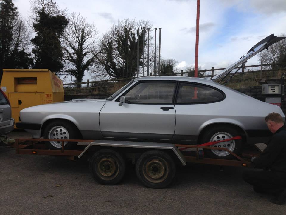 silver car on trailer