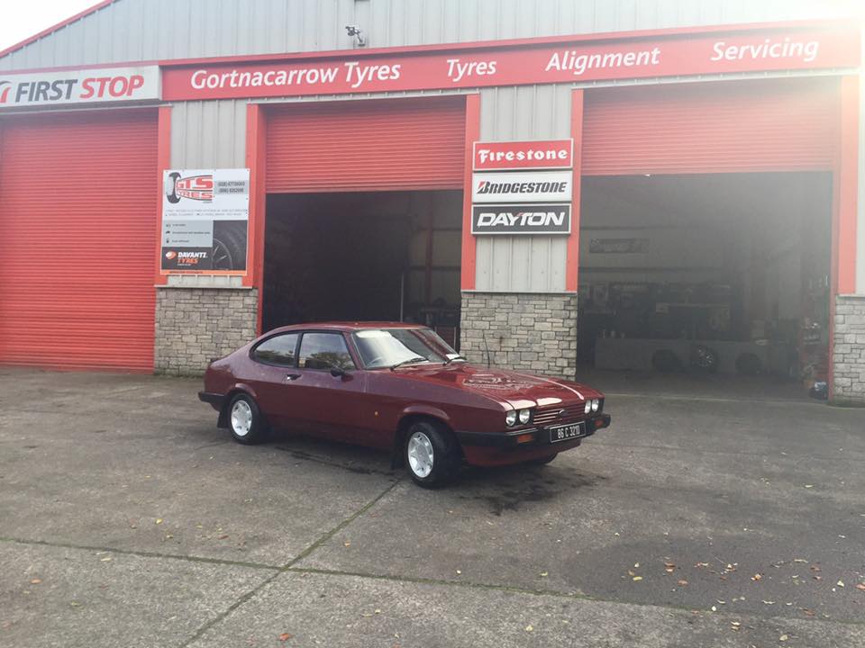 photo of red car outside gts tyres