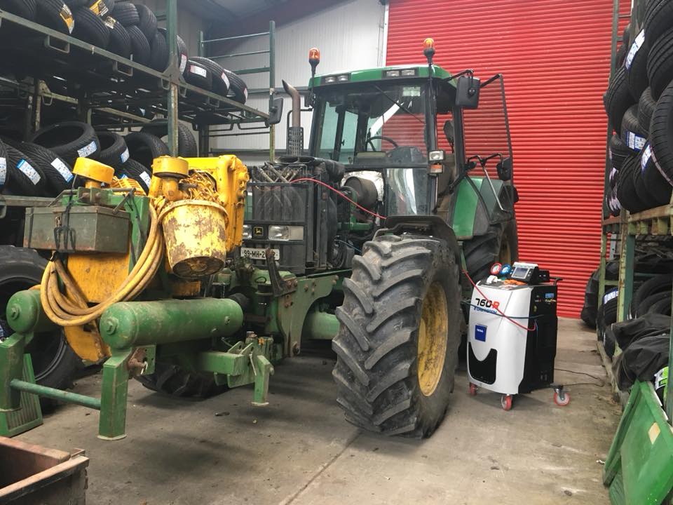 image of tractor getting serviced