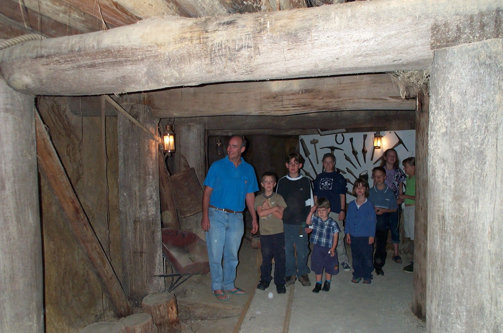 tour-guide-showing-kids-through-mine