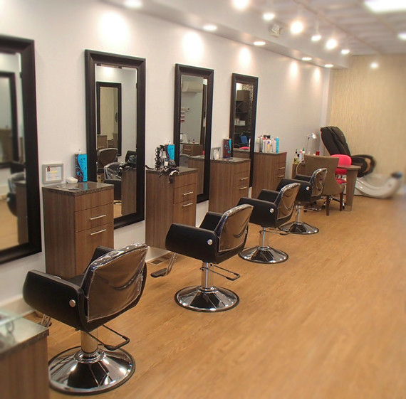 A row of chairs and mirrors in a salon