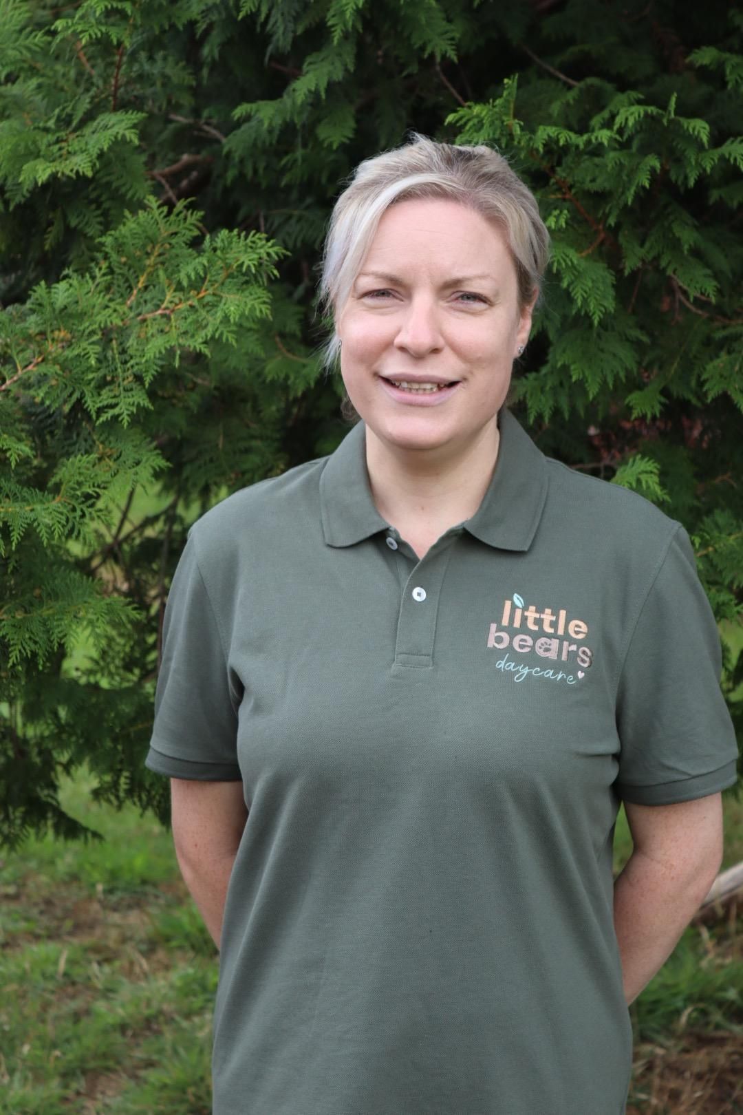 Woman in green polo shirt, 