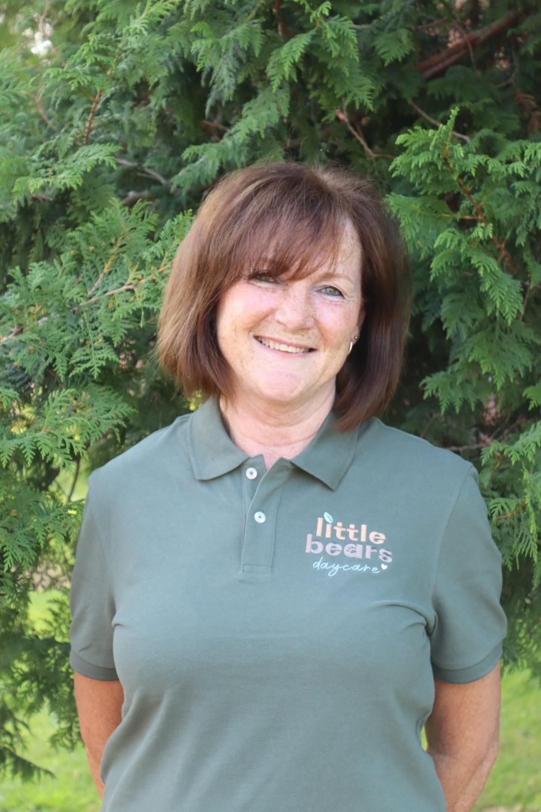 Woman in green polo shirt, 