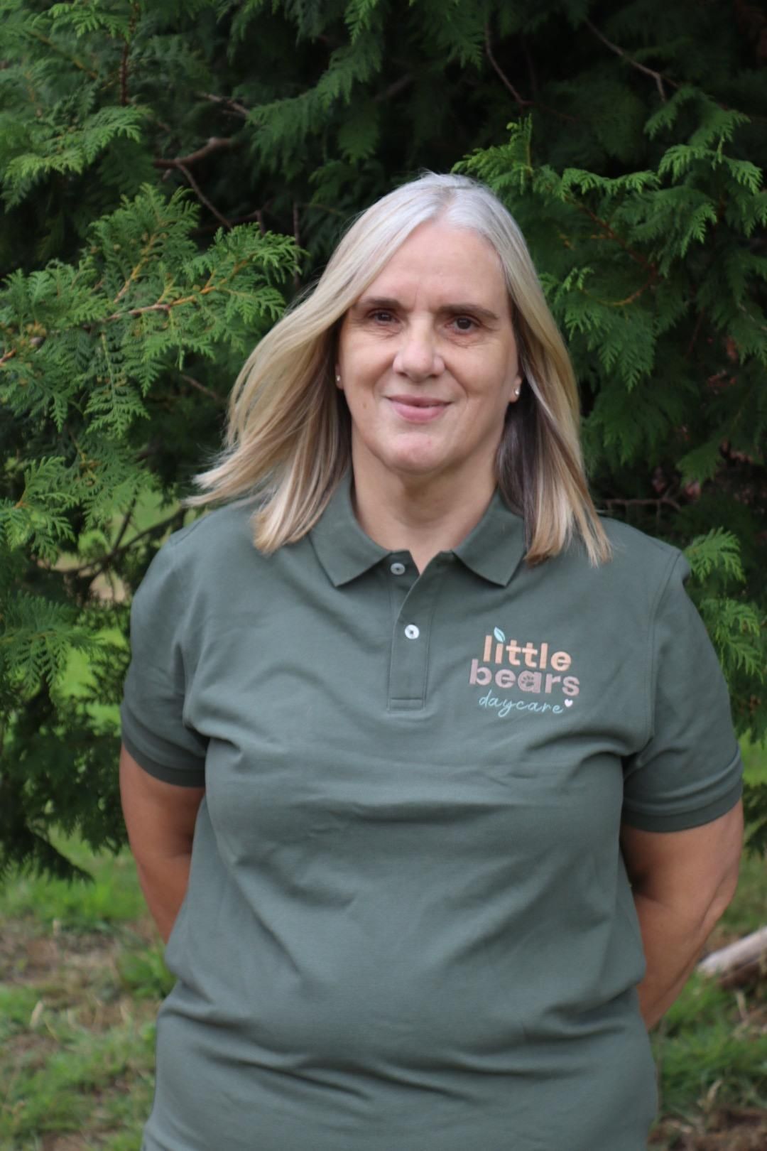 Woman in green polo shirt, 