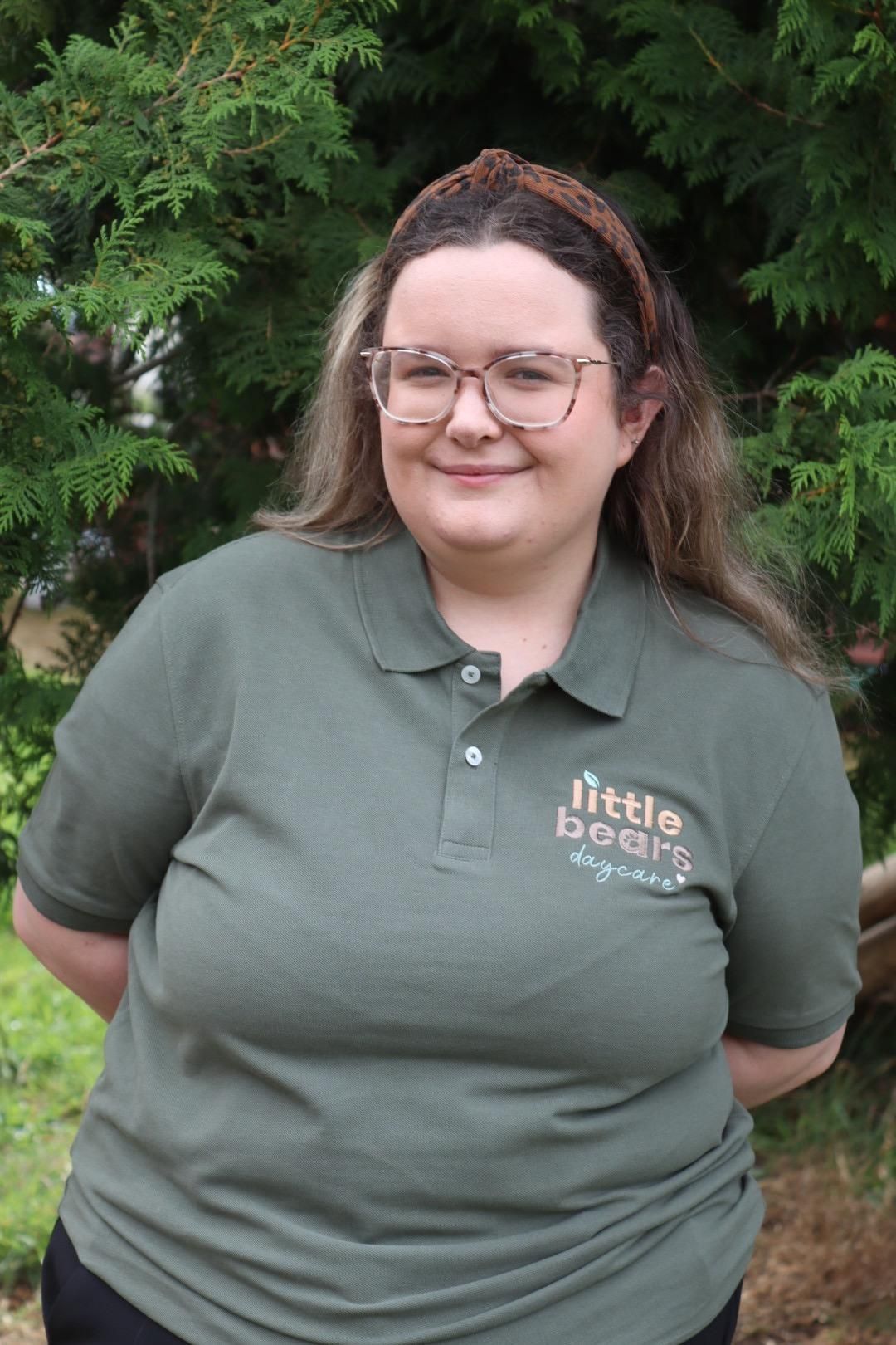 Woman in green polo shirt, 