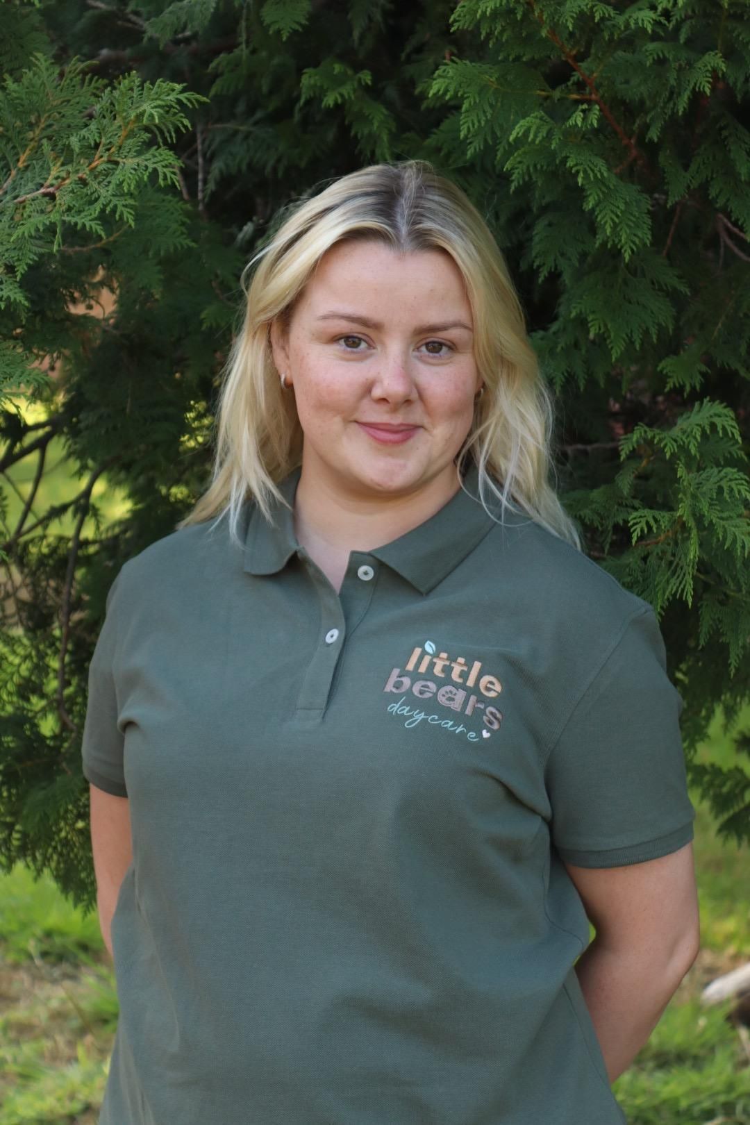Woman in green polo shirt, 
