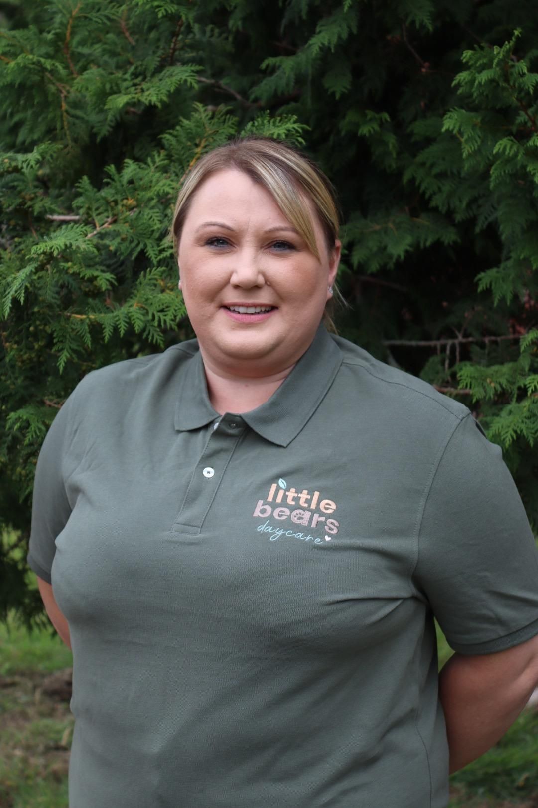 Woman wearing green polo shirt with 