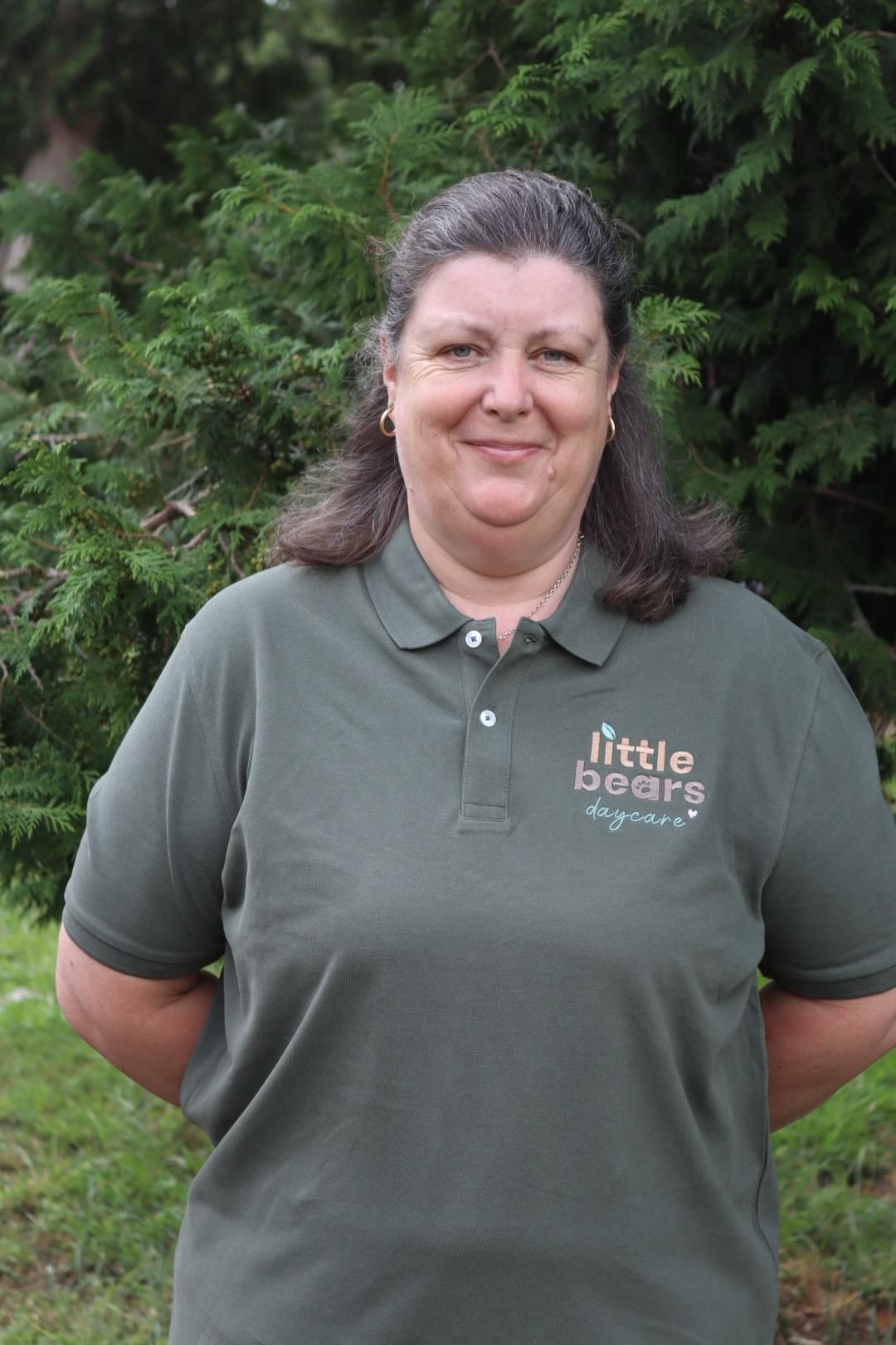 Woman in green polo shirt with 