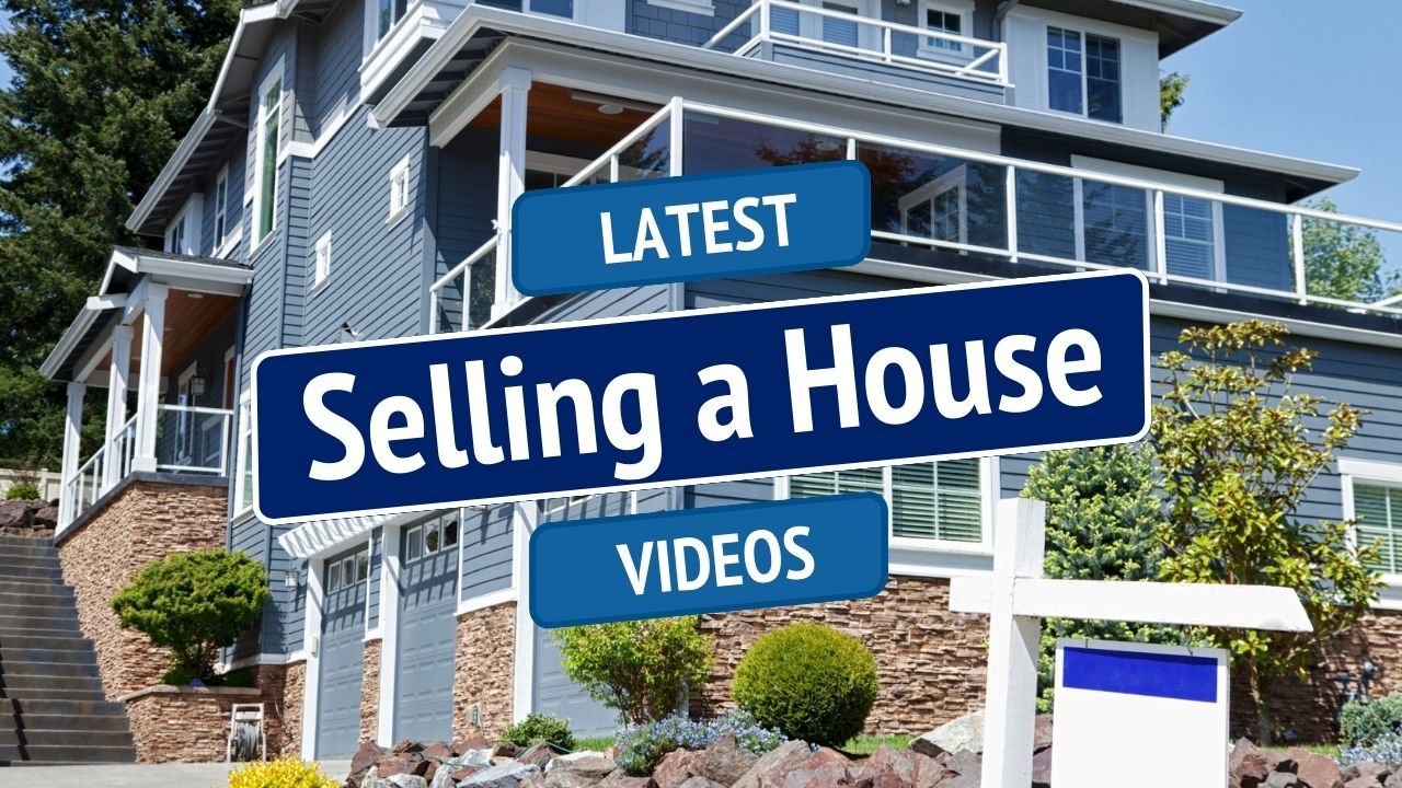 Blue real estate sign reading “Selling a House” with “Latest” and “Videos” in front of a house
