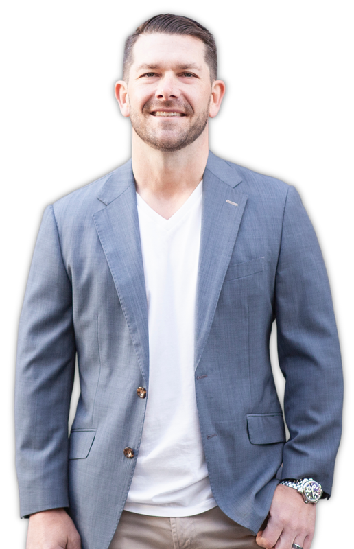 Smiling man in a blue blazer and white T-shirt against a white background