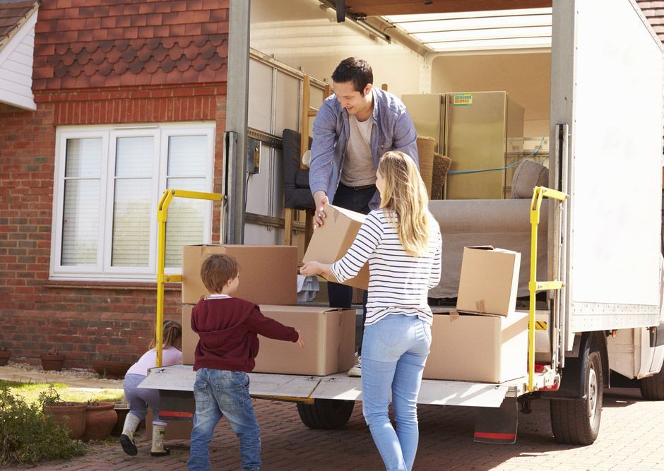 Family Unpacking Moving Boxes — Removalists In Hunter Region, NSW