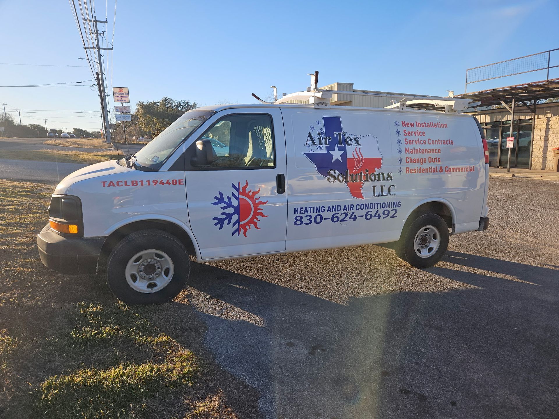 White AirTex HVAC service van with Texas logo parked outdoors.