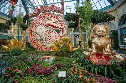 Mobile Detailing-there is a statue of a lion in the middle of a garden .