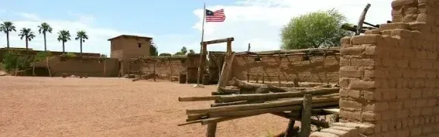 Mobile Detailing-an american flag is flying in the middle of a desert .