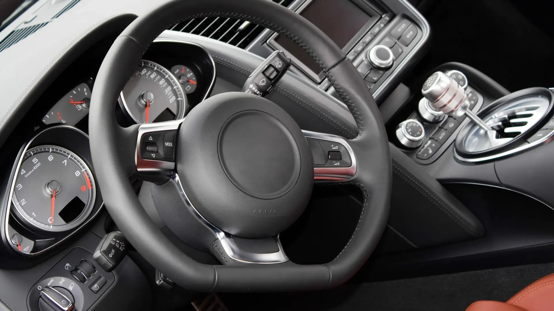 a close up of a steering wheel in a car