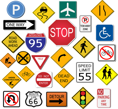 Assorted colorful road signs, including stop, speed limit, parking, detour, and warning signs, on a white background.