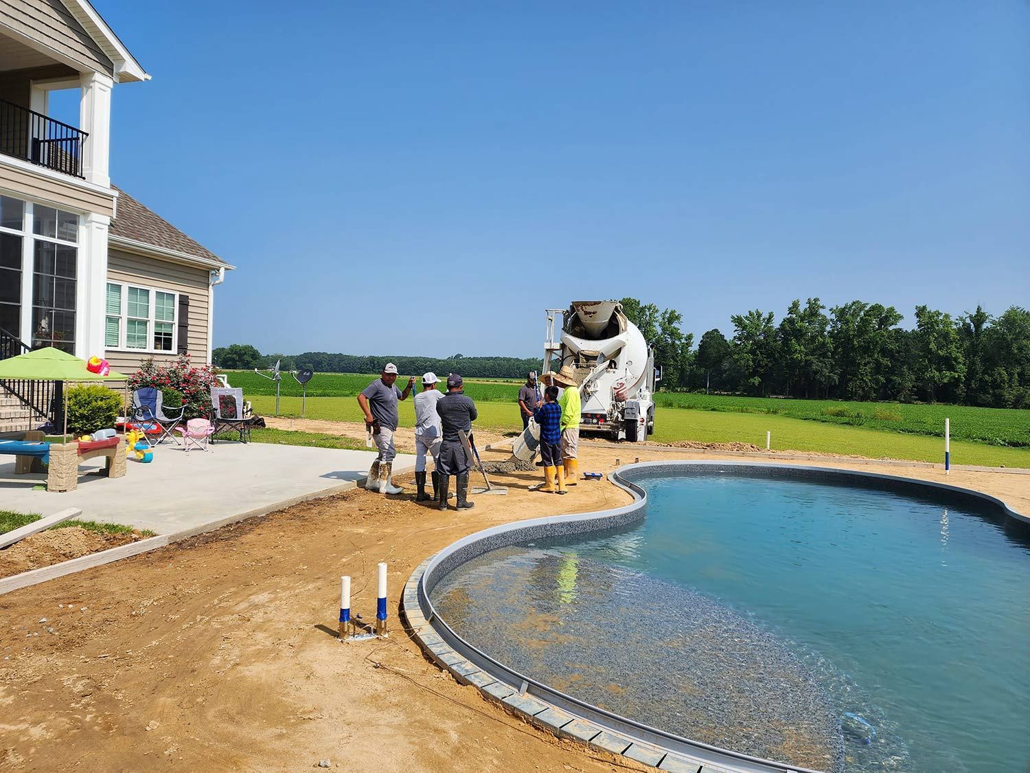 Installing Concrete Floor Around a Pool — Kinston, NC — Hugo's Concrete LLC