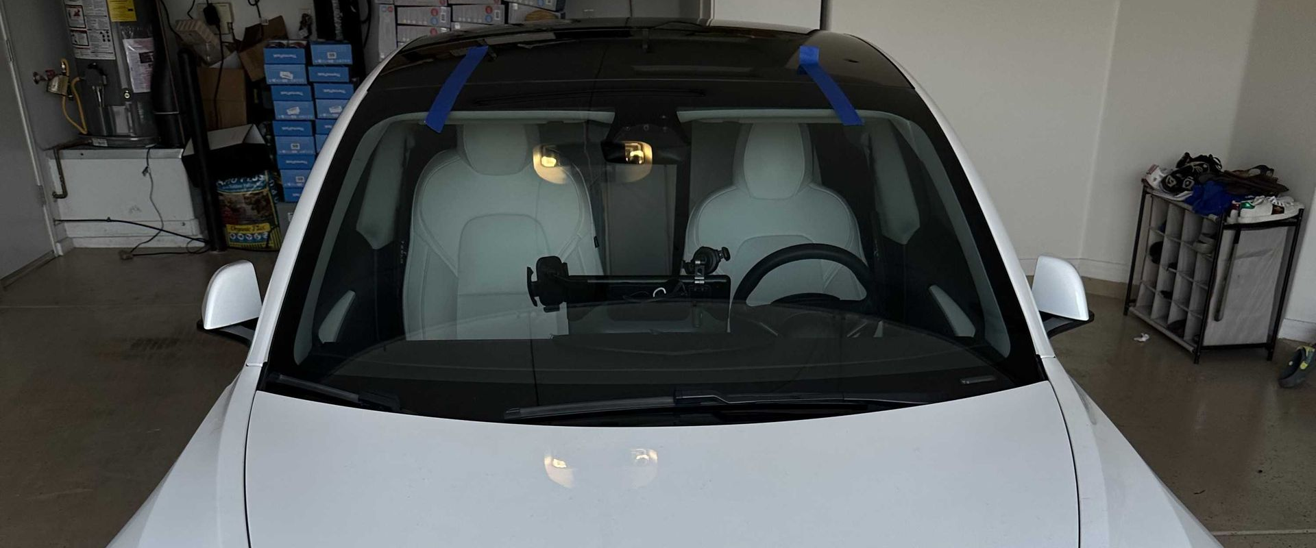 After a windshield replacement on a white Tesla.