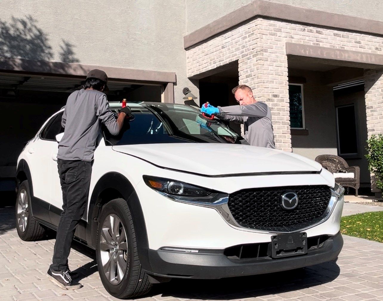 Windshield replacement by auto glass technicians at your house.