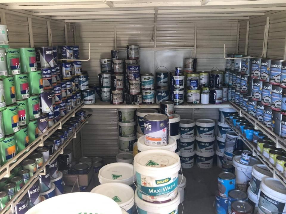 A Room Filled With Lots Of Buckets And Cans Of Paint — Paint & Trade Supplies Lismore In Goonellabah, NSW