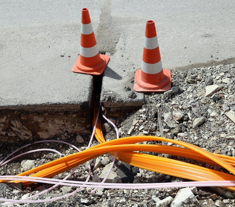 Road Construction With Pipes for Laying Optical Fiber — Hennig Electrical Services in Nambour, QLD