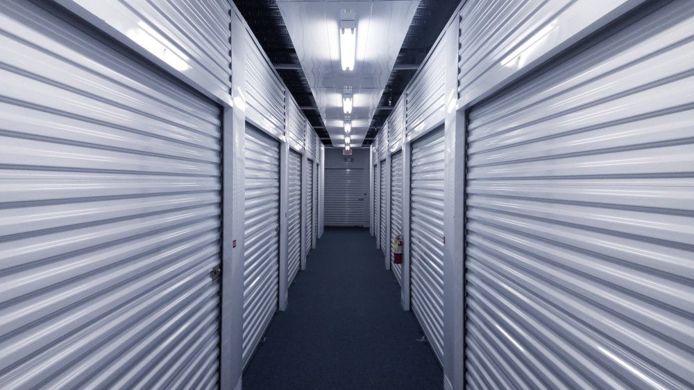 Storage Units on a Blue Carpeted Hallway — Hennig Electrical Services in Nambour, QLD
