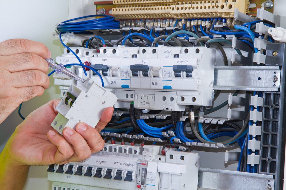 A Reliable Electrician At Work On The Sunshine