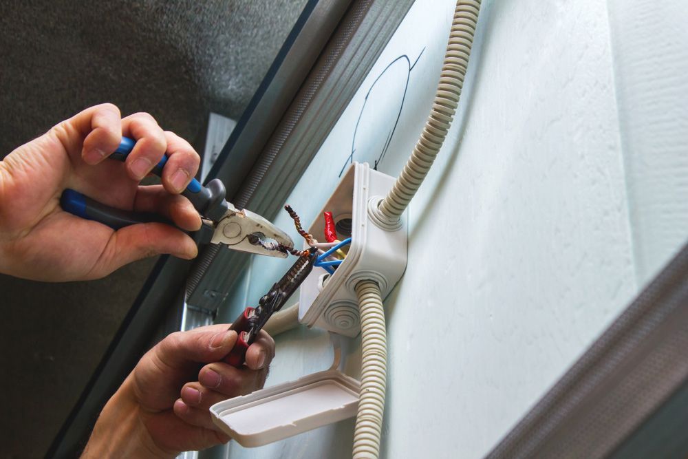 Electrician Mounts The Electrical Wiring— Hennig Electrical Services in Nambour, QLD