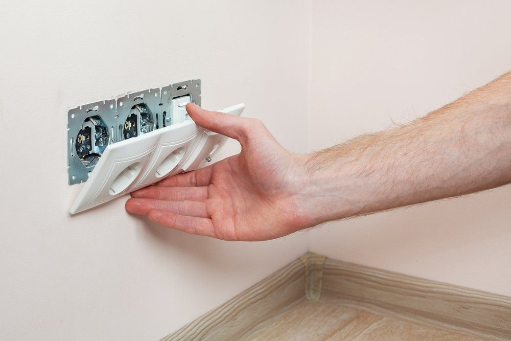 Pulling Out the Plug Cover — Hennig Electrical Services in Nambour, QLD