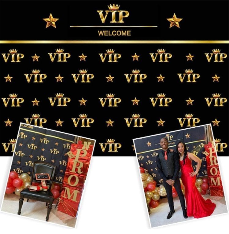 A man and woman are standing in front of a wall that says vip welcome