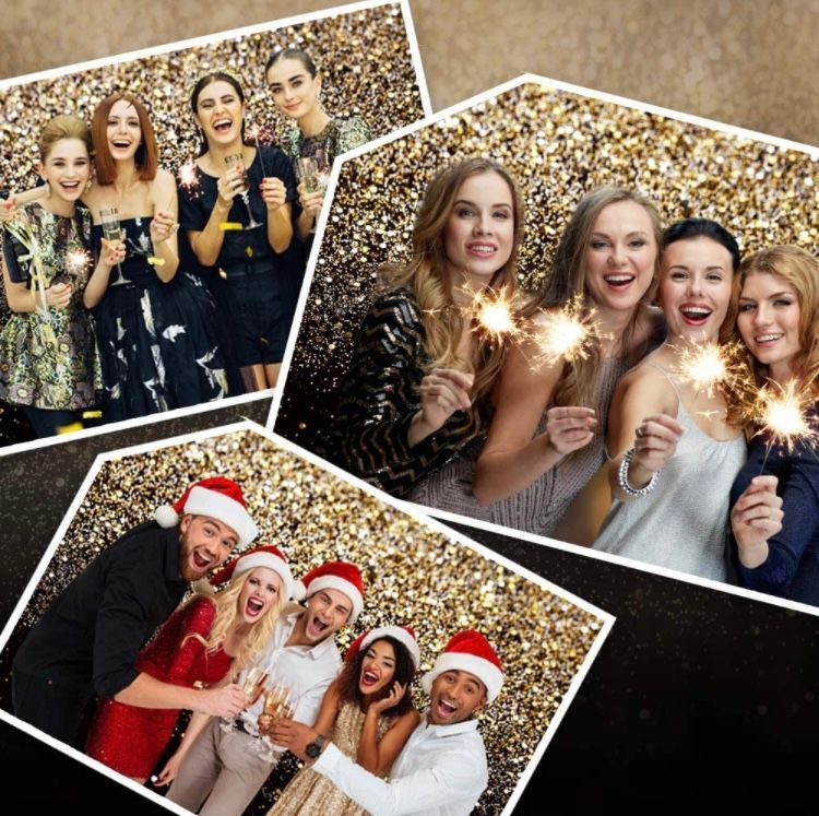 A group of people are posing for a picture while holding sparklers. Photo