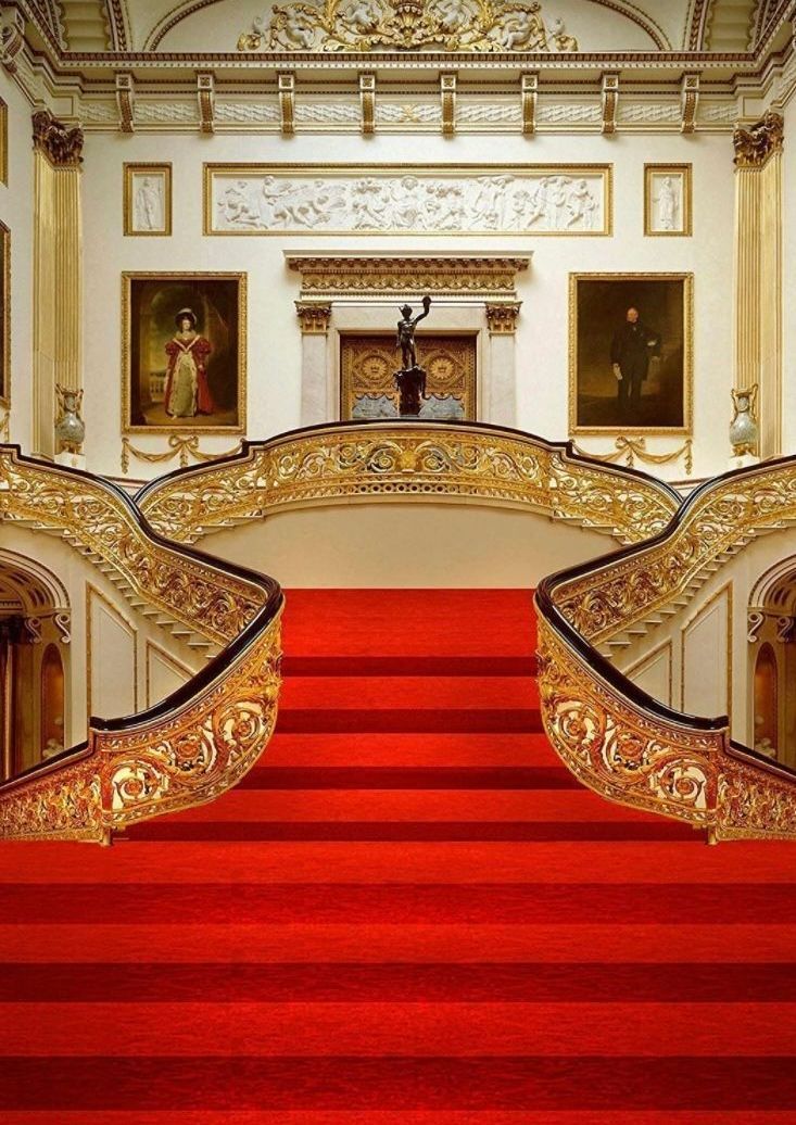 There is a red carpet on the stairs of a castle. Photo Booth Rental Las Vegas