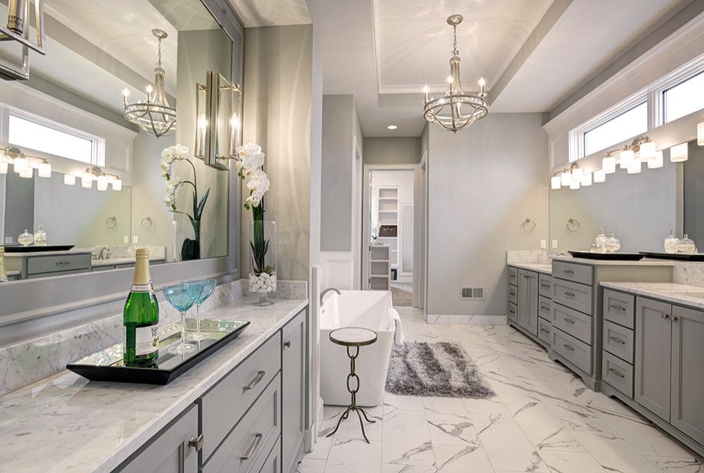 There is a bottle of champagne on the counter in the bathroom