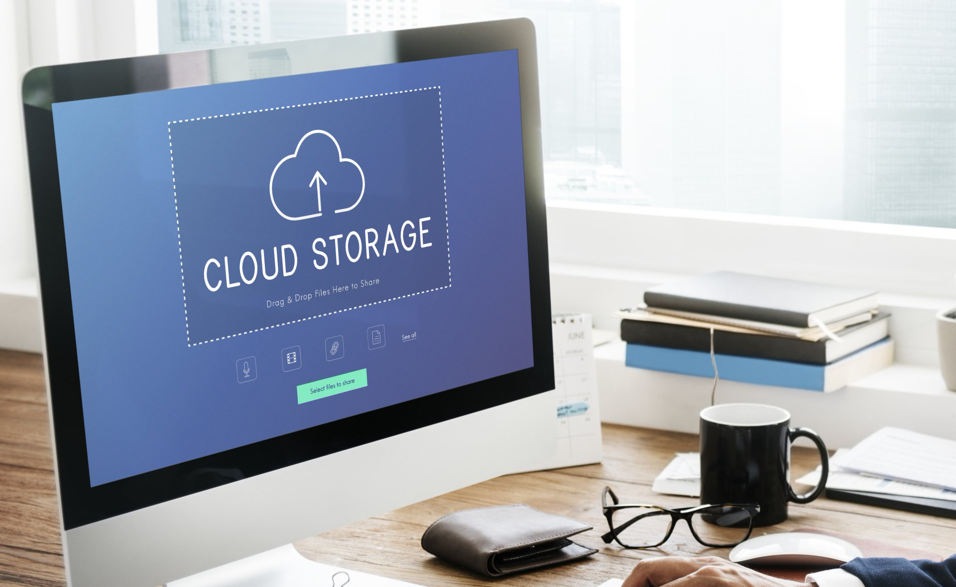 computer screen with cloud storage graphic on screen