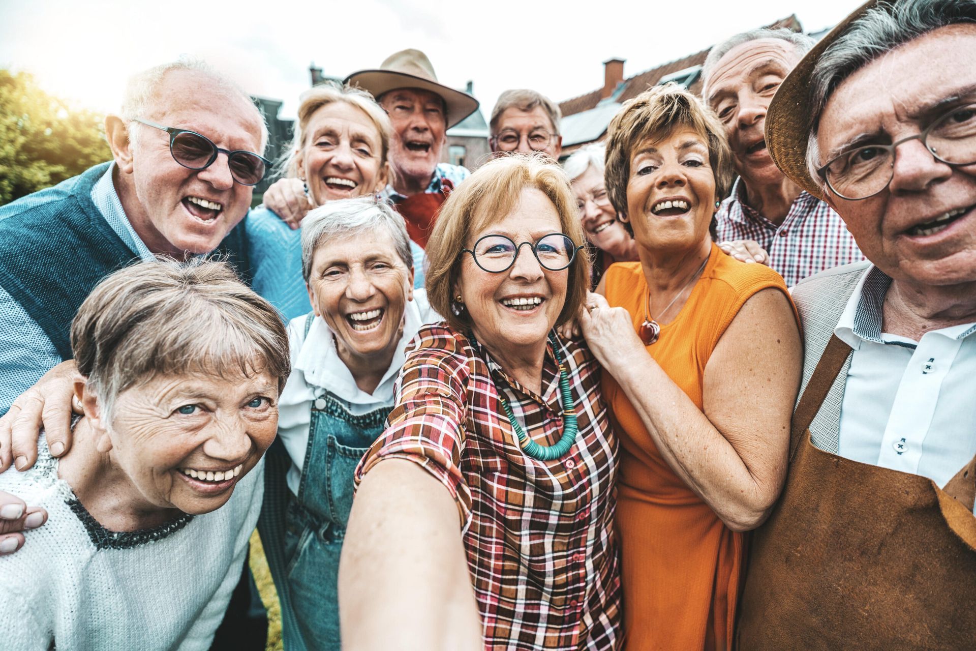 A group of elderly people are taking a selfie together.