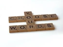 A scrabble board with the words `` choose words '' written on it.