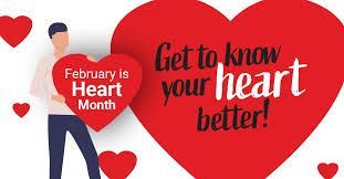 February is heart month and a man is holding a large red heart.