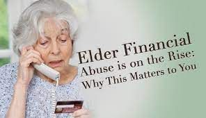 An elderly woman is talking on a phone while holding a credit card.