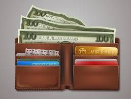 A brown wallet filled with money and credit cards.