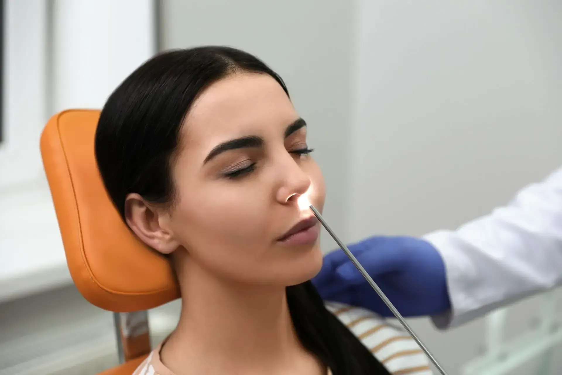 ent-doctor-examining-patient-with-modern-equipment