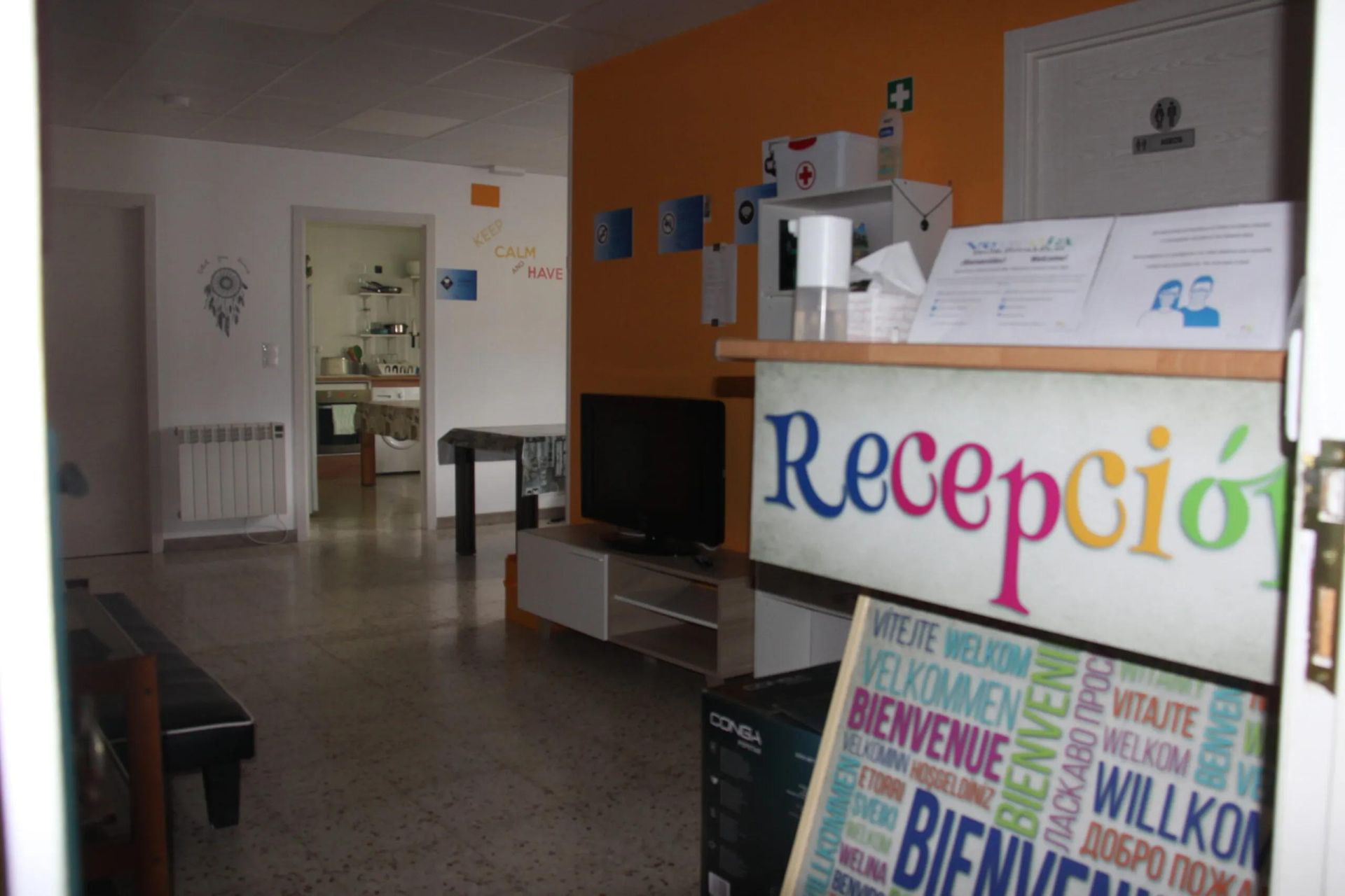 Reception area with orange wall and 
