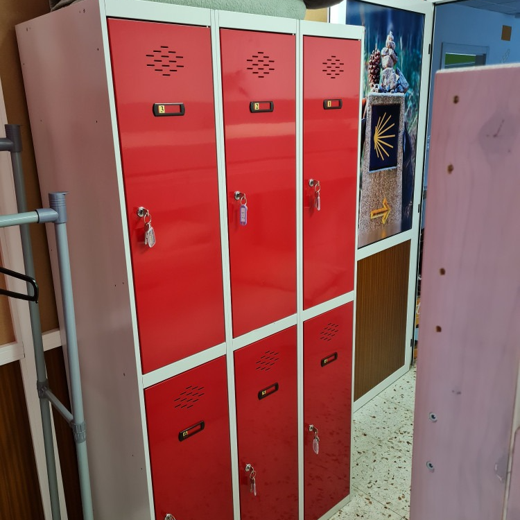 Red and white metal lockers with key locks.
