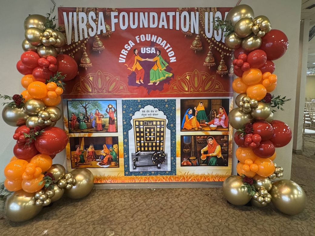 Corporate foundation party with red orange and gold balloons