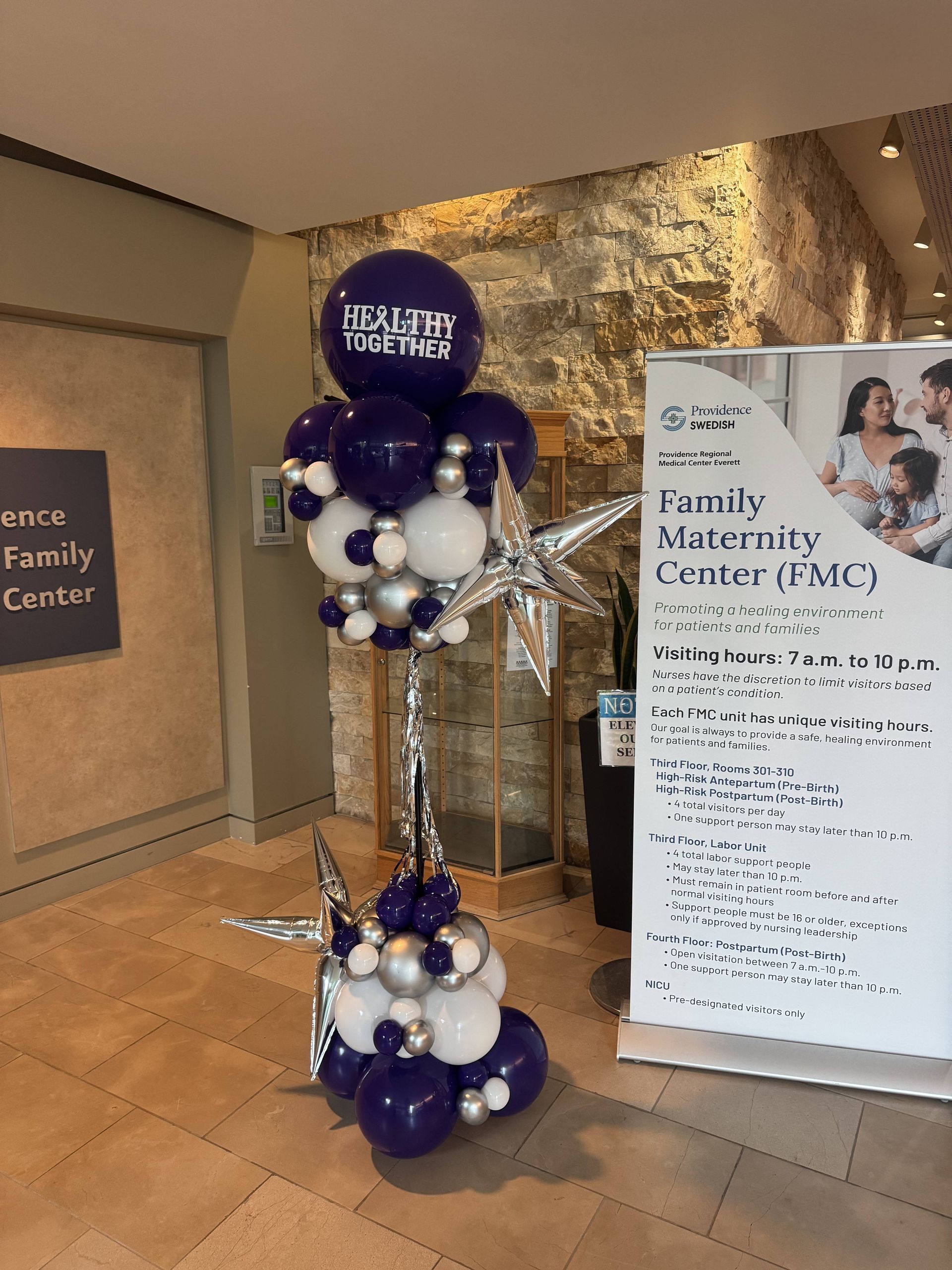 Corporate hospital event with purple balloons