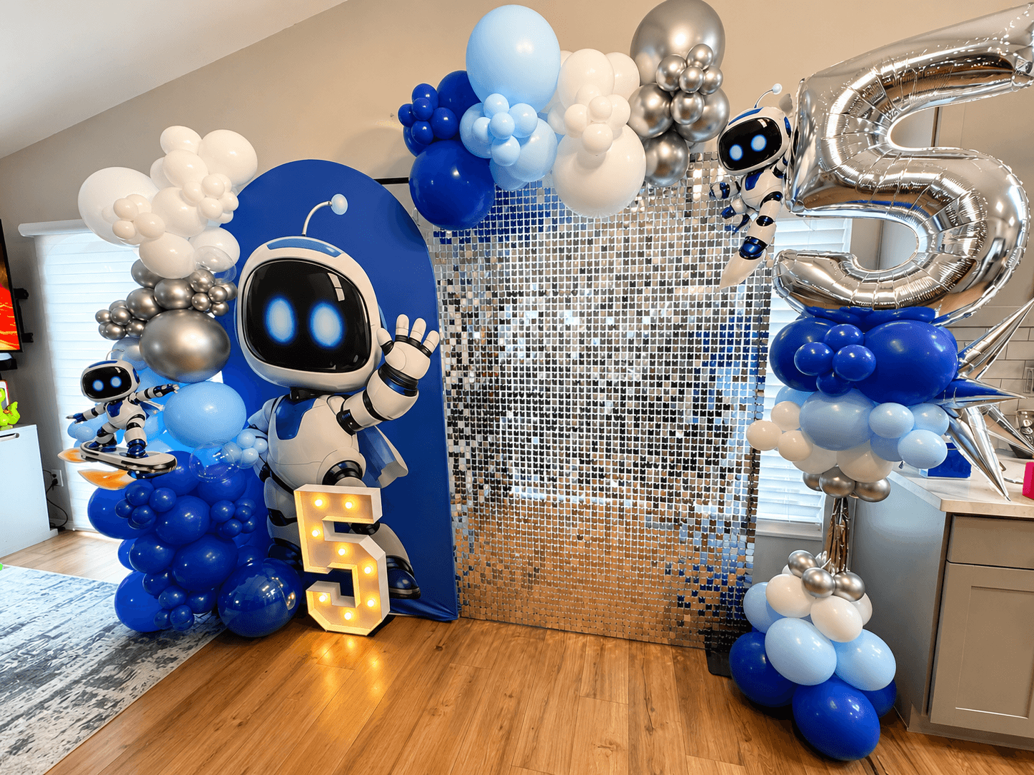 5 year old party with blue and silver balloons