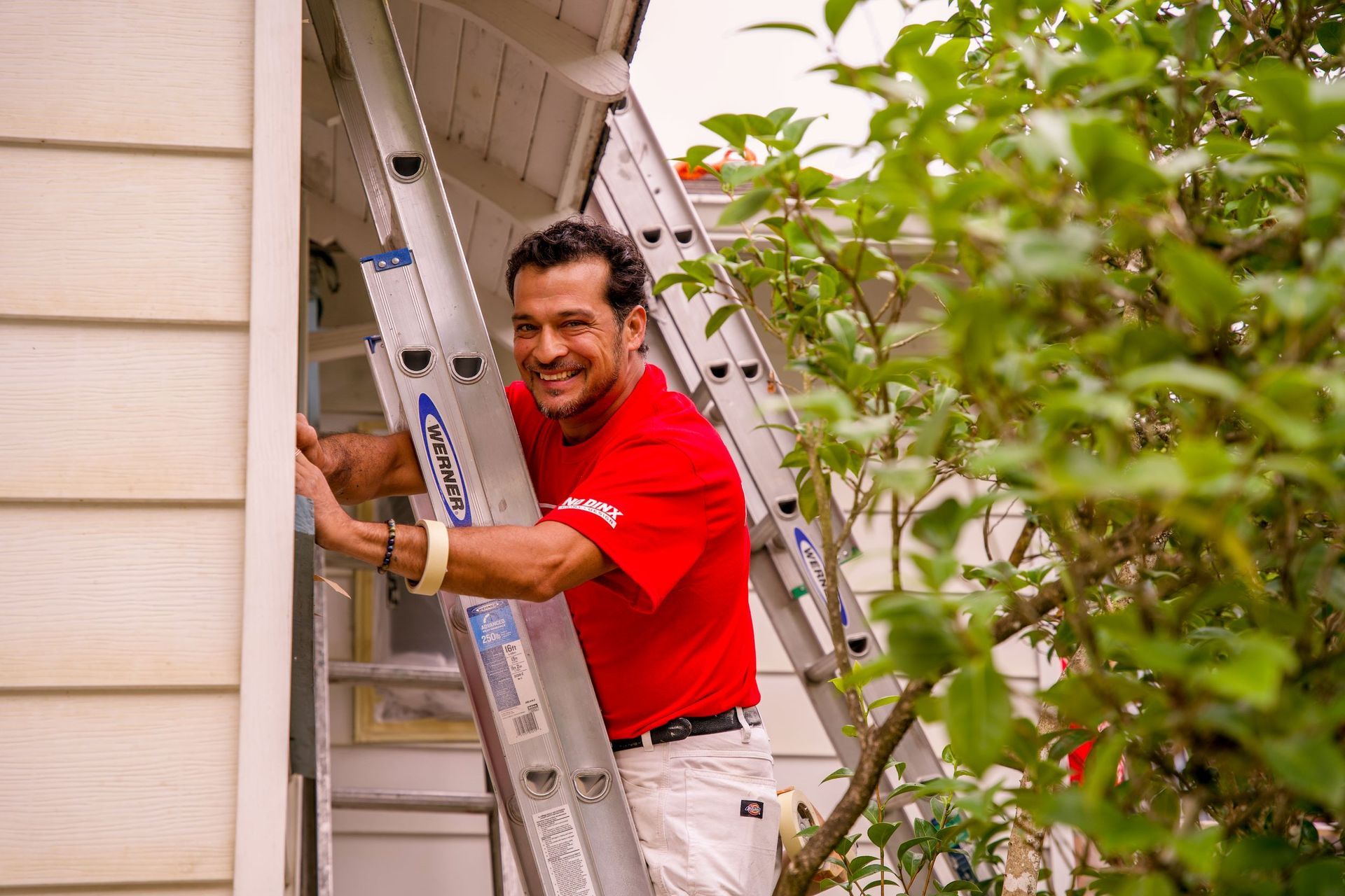 Fitzpatrick painter working on house
